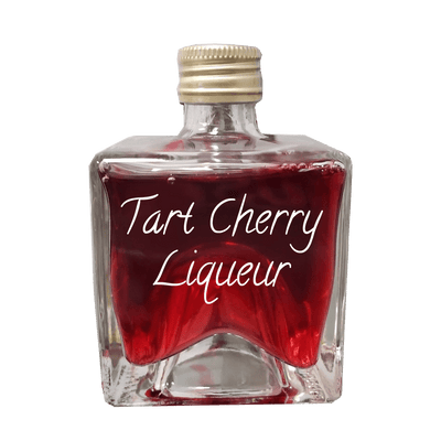 Tart Cherry Liqueur in small bottle. Fruity drinks. Popular alcoholic drinks