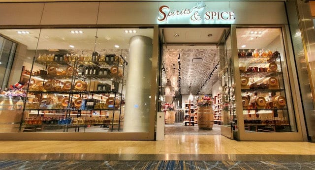 Storefront of 'Spice & Spice' with shelves displaying various items.
