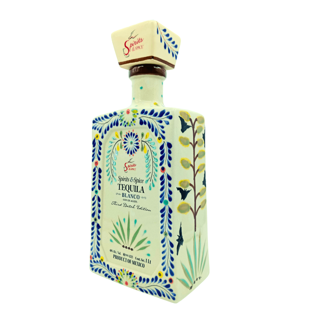 Tequila bottle with decorative design on a white background
