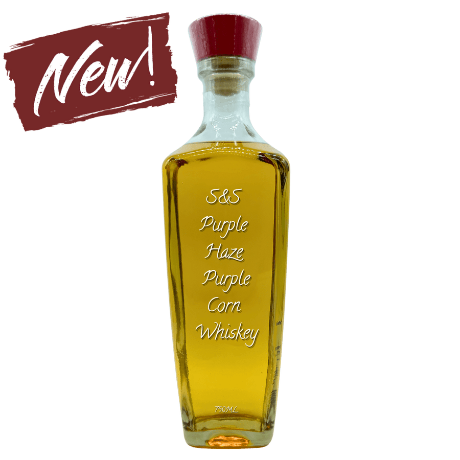 Bottle of S&S Purple Haze Purple Corn Whiskey with a red cap on a white background