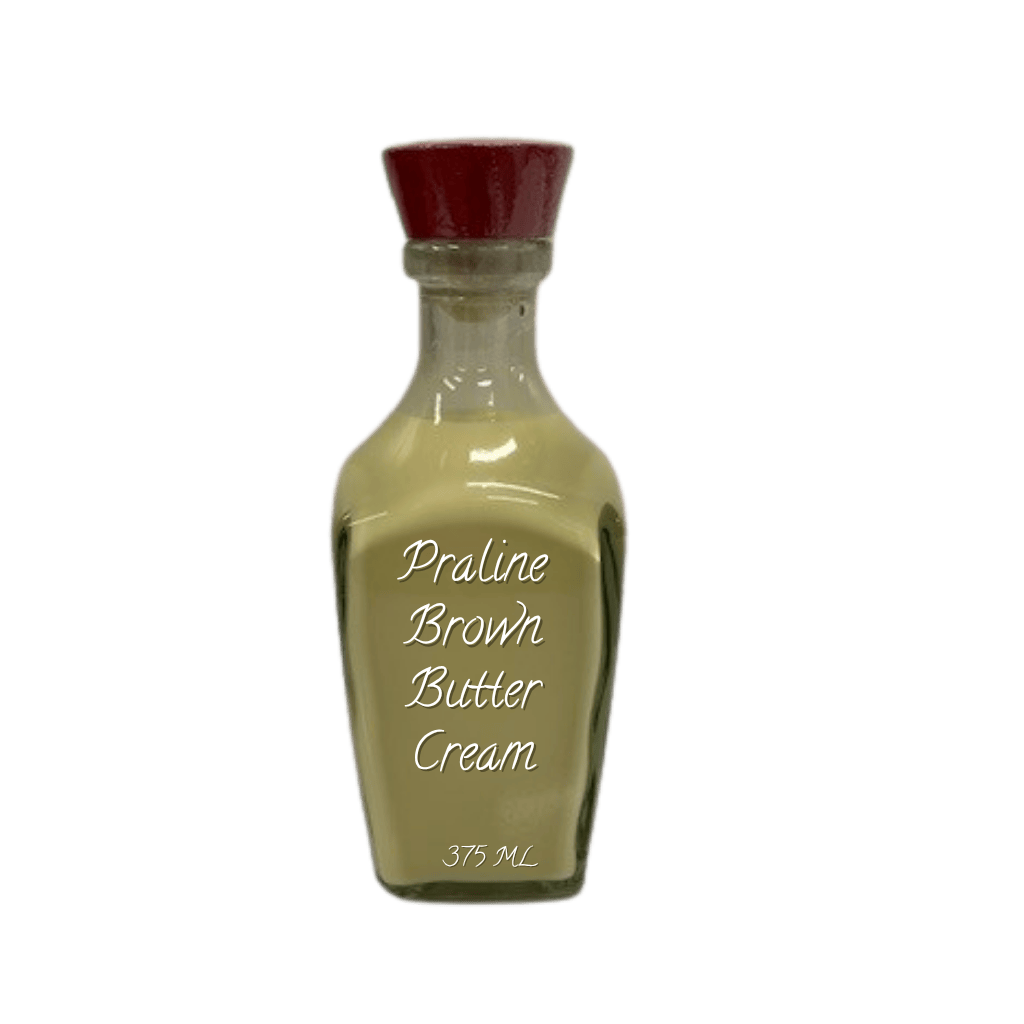 Bottle of praline brown butter cream with a red cap on a white background
