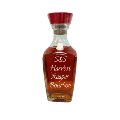A small clear glass bottle filled with amber-brown bourbon, with a red cap, and white script text reading 'S&S Harvest Reaper Bourbon' on the front, shown on a plain white background.
