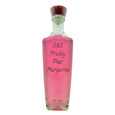 A clear glass bottle filled with pink liquid, featuring a dark brown cork stopper and black handwritten text on the front reading 'S&S Prickly Pear Margaritta' and '750 ML' at the bottom, isolated on a white background.