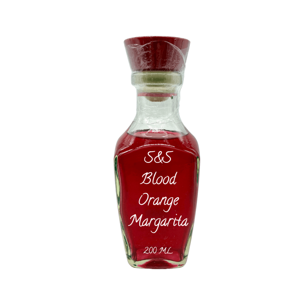 A small clear glass bottle filled with red liquid, featuring a dark red cap and a white printed label that reads 'S&S Blood Orange Margarita 200 ML'.