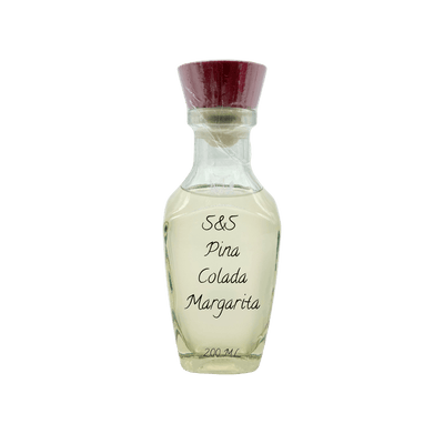 A clear glass bottle of S&S Pina Colada Margarita fragrance with a dark red cap, containing a pale yellow liquid, set against a plain white background.