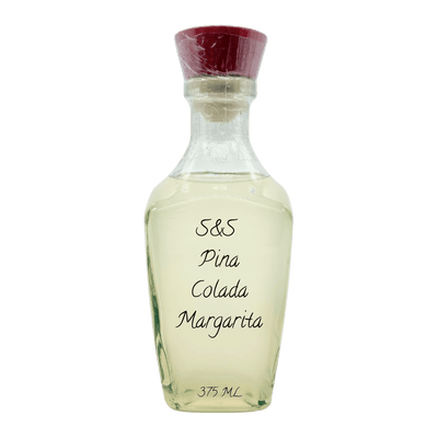 A clear glass bottle of S&S Pina Colada Margarita with a dark red wax seal cap, containing a pale yellow liquid, on a white background.