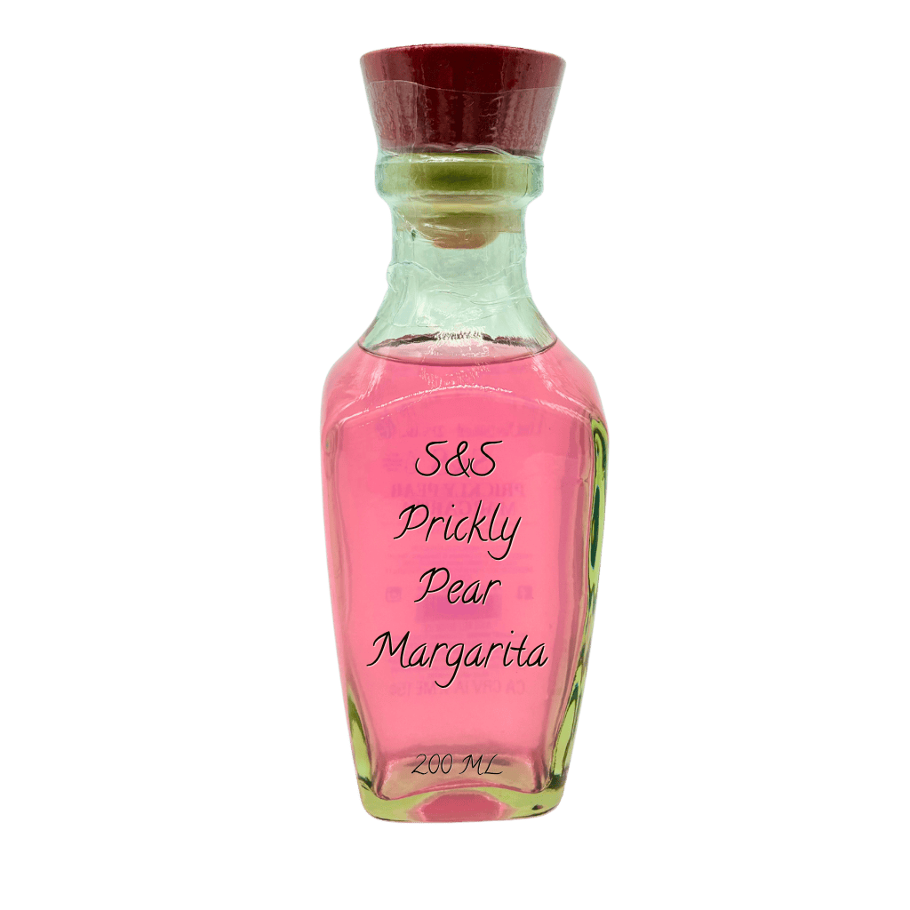 A small glass bottle filled with pink liquid, labeled 'S&S Prickly Pear Margarita 200 ML', topped with a dark red cork stopper, shown on a plain white background.