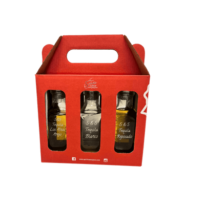 Red gift box with three tequila bottles inside on a white background