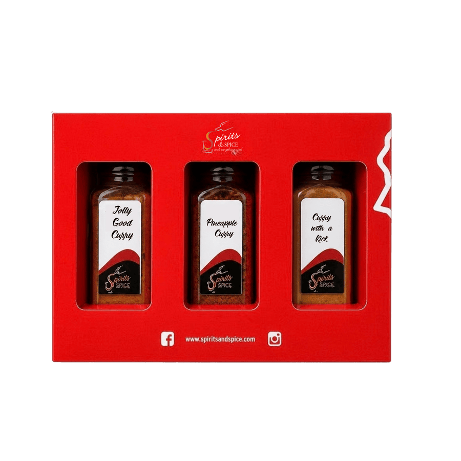 A red gift set box containing three small bottles of curry spices: Jolly Gold Curry, Phoenicope Curry, and Curry with a Root. The brand Spirit of Spice is visible on the bottles and box.