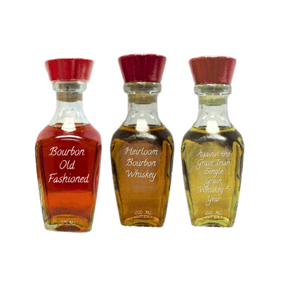 three bottles of whiskey on a white background. fathers day set