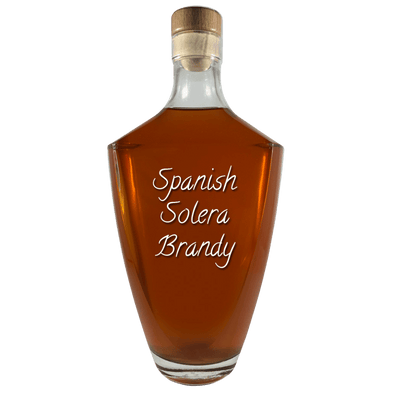 Spanish Solera Brandy in large bottle. Bar drinks. Spirits. Popular alcoholic drinks. Brown liquor.