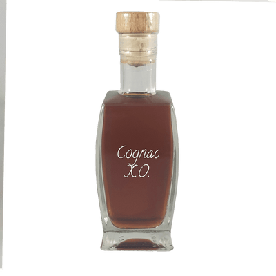Cognac XO in small bottle. Aged alcoholic drinks. Drinks from France or Paris.