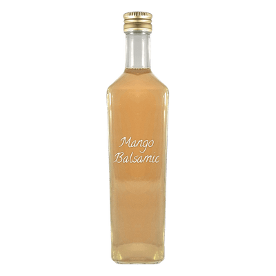 Mango Balsamic Vinegar in bottle. Distilled vinegar. Mango vinegar for cooking.