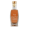 Pink Grapefruit Liqueur in small bottle. Aged alcoholic drinks. Drinks from France or Paris.