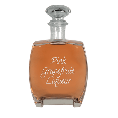 Pink Grapefruit Liqueur in medium bottle. Best cocktails. Smooth and sweet alcoholic drinks.