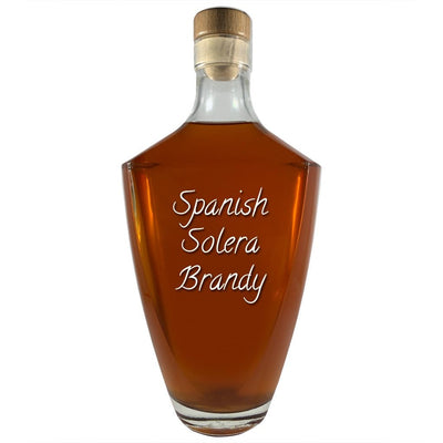 Spanish Solera Brandy in large bottle. Bar drinks. Spirits. Popular alcoholic drinks. Brown liquor.