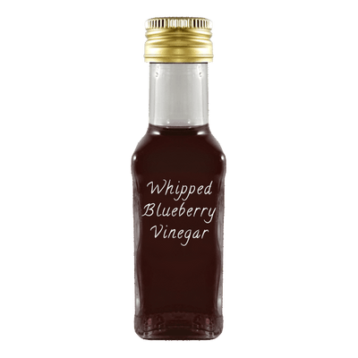 Whipped Blueberry Vinegar in bottle. Aged balsamic vinegar. White alcohol vinegar