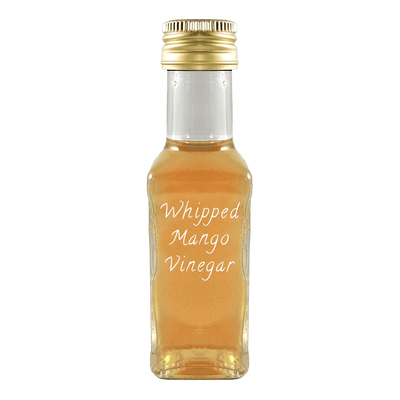 Whipped Mango Vinegar in bottle. Balsamic vinegar vs vinaigrette. Popular vinegars for cooking.