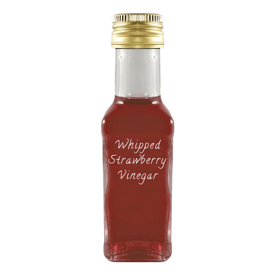 Whipped Strawberry Vinegar in bottle. Aged balsamic vinegar. Dark alcohol vinegar