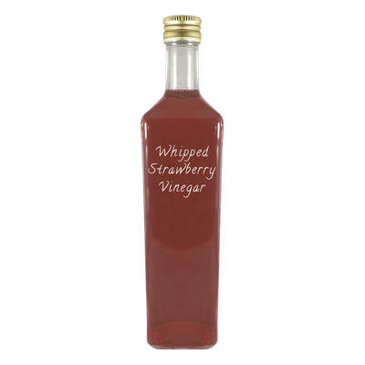 Whipped Strawberry Vinegar in bottle. Dark balsamic vinegar. Fruity vinegars.