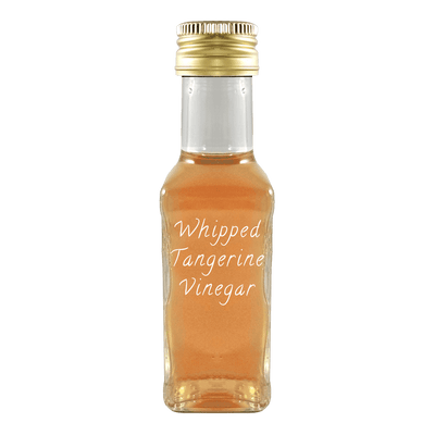 Whipped Tangerine Vinegar in bottle. Aged balsamic vinegar. White alcohol vinegar