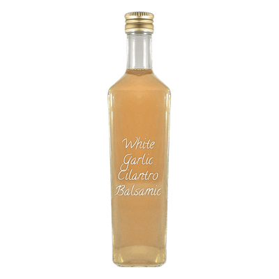 White Garlic Cilantro Balsamic Vinegar in bottle. Distilled vinegar. Garlic Vinegar for cooking.